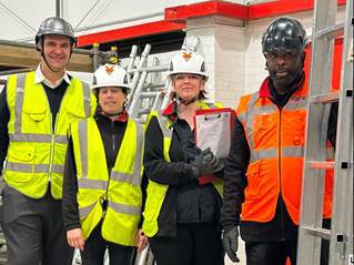 A group of people wearing safety vests and helmets

AI-generated content may be incorrect.